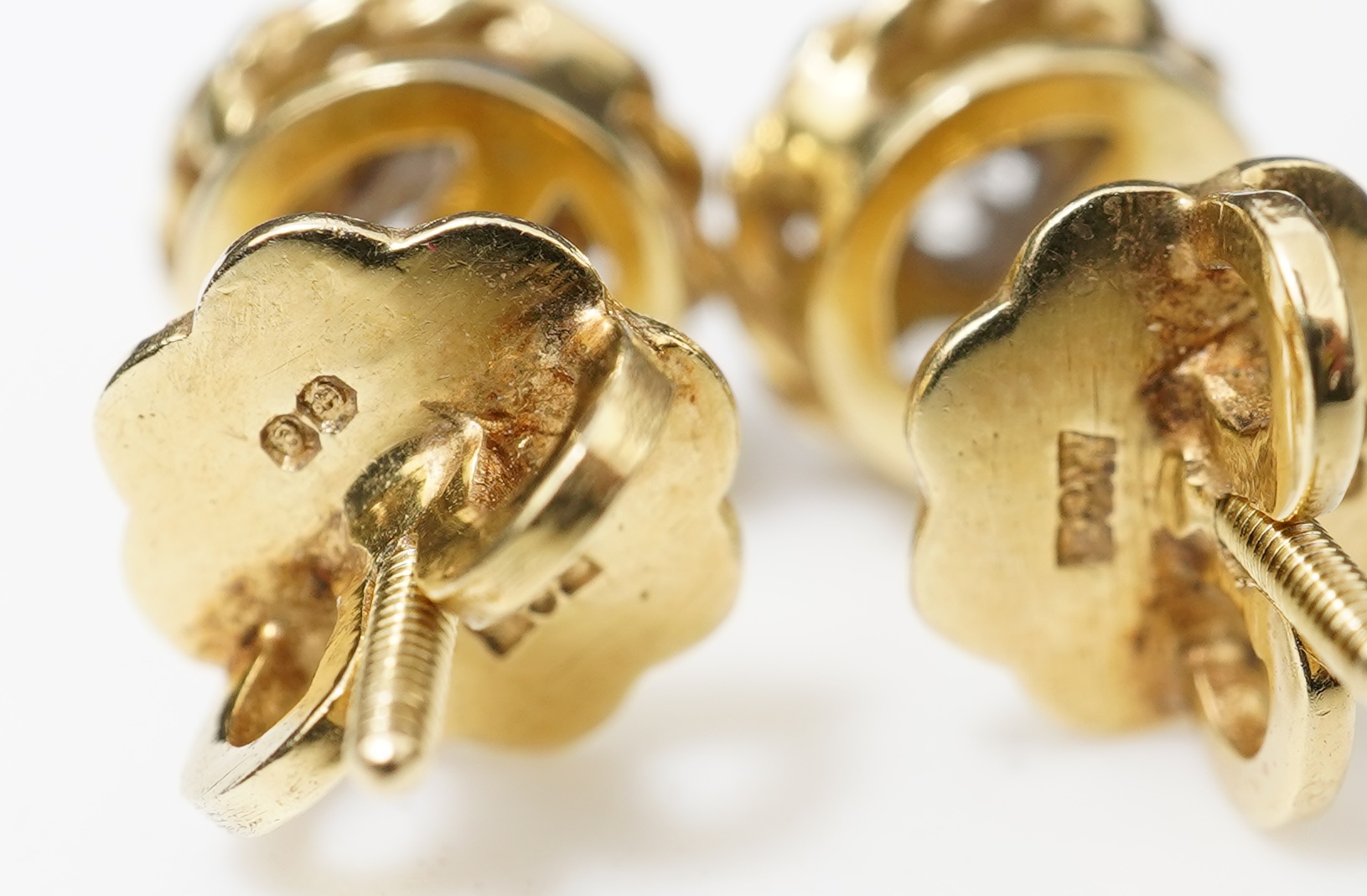 A pair of diamond stud earrings